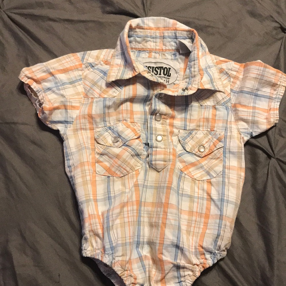 Short sleeve pearl snap baby shirt.